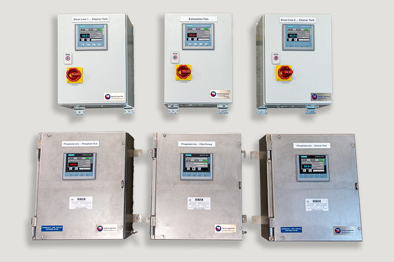 Six completed factory automation control panels