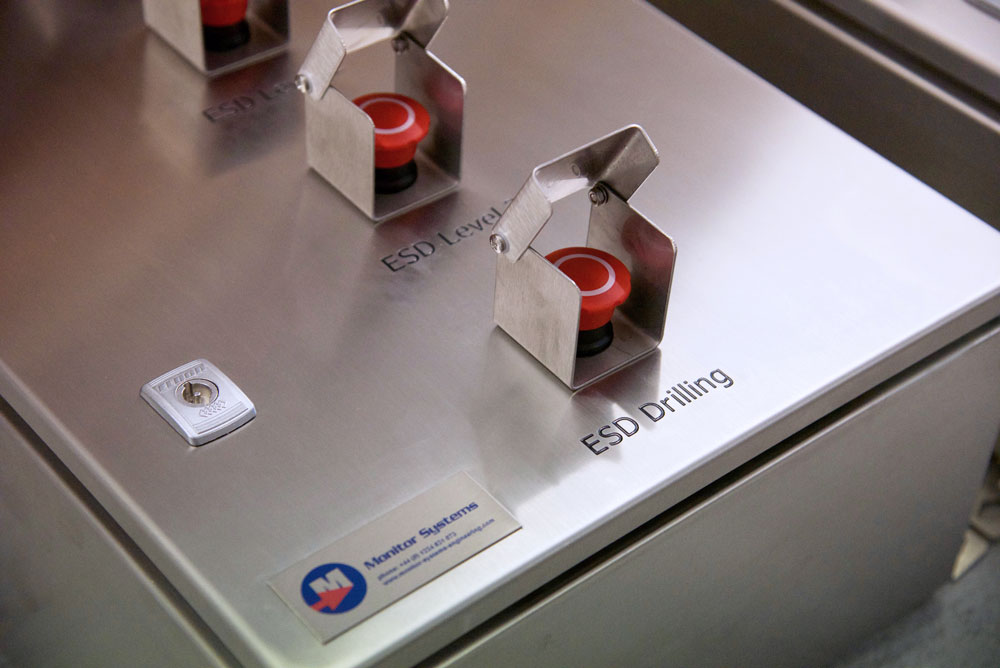 Guarded ESD level and drilling shutdown buttons