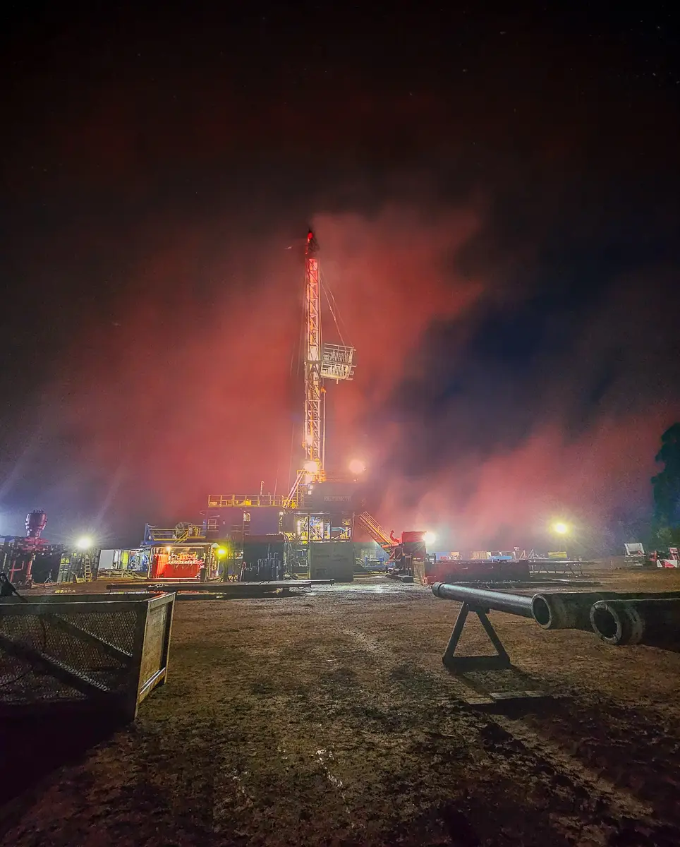 Land drilling rig during evening operations