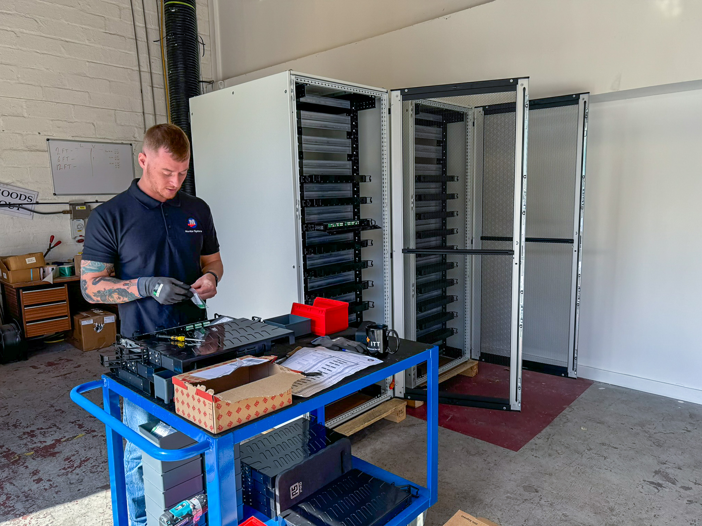 Technician assembling ODF fibre hardware in the workshop